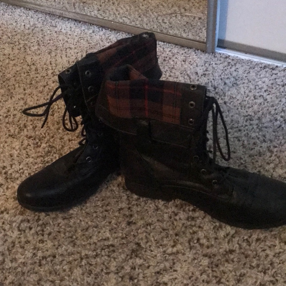 Black combat boots with plaid lining
